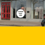Storefront featuring a circular window decal with 'Company Logo Here' text.