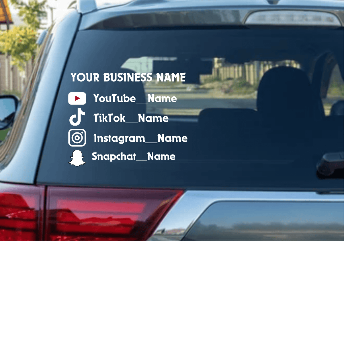 Custom vehicle decal showcasing business social media handles on a rear car window.