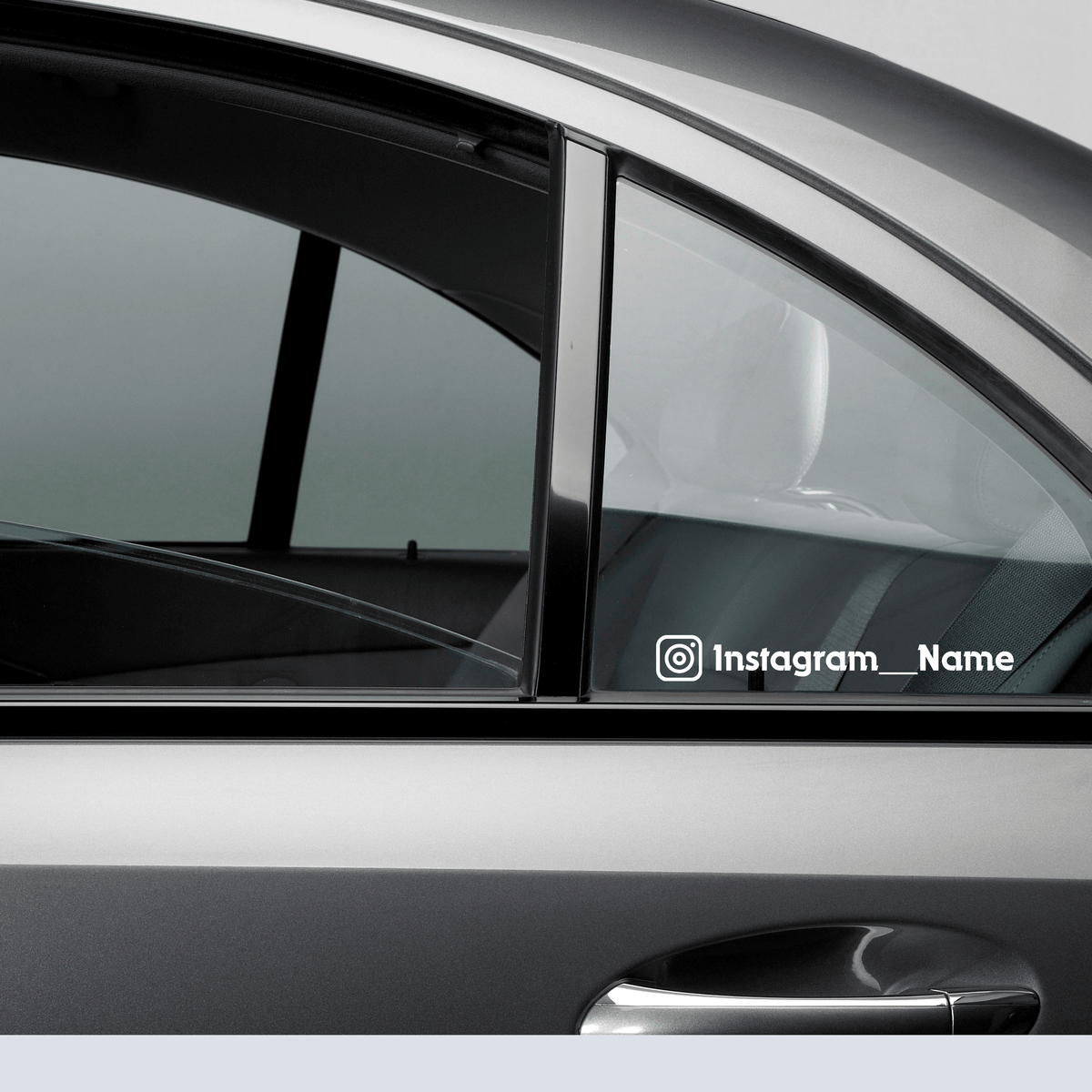 Custom waterproof decal on a car window displaying Instagram handle for promotional use.